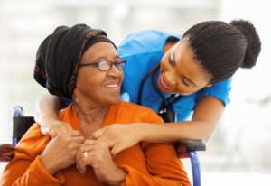 african senior patient with female nurse