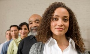 Group of business people standing in row, portrait