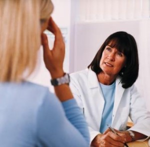 Doctor Listening to Patient Talk About Her Medical Symptoms